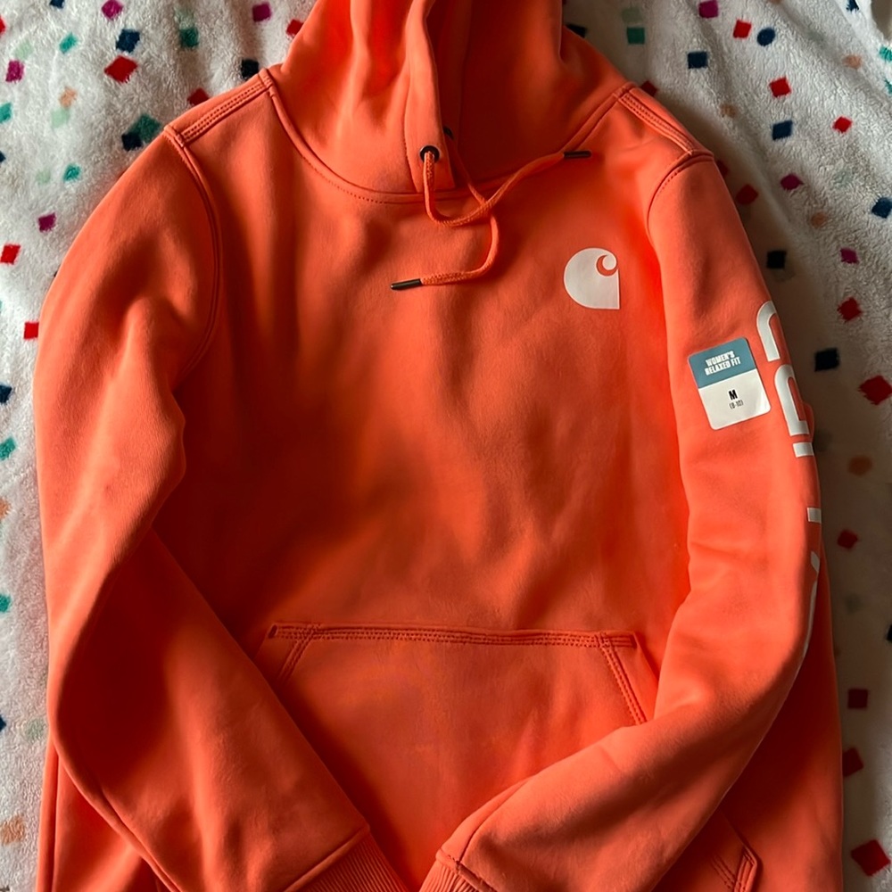 Coral color hoodie from Carhartt